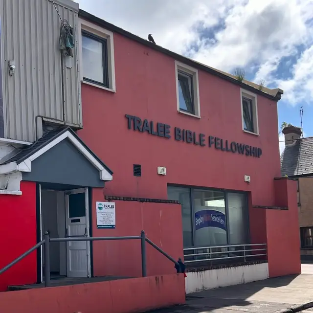 The red CWS Centre building on Upper Rock Street with the Tralee Bible Fellowship sign