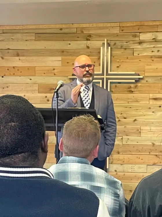 Pastor Josh Steward preaching at Tralee Bible Fellowship